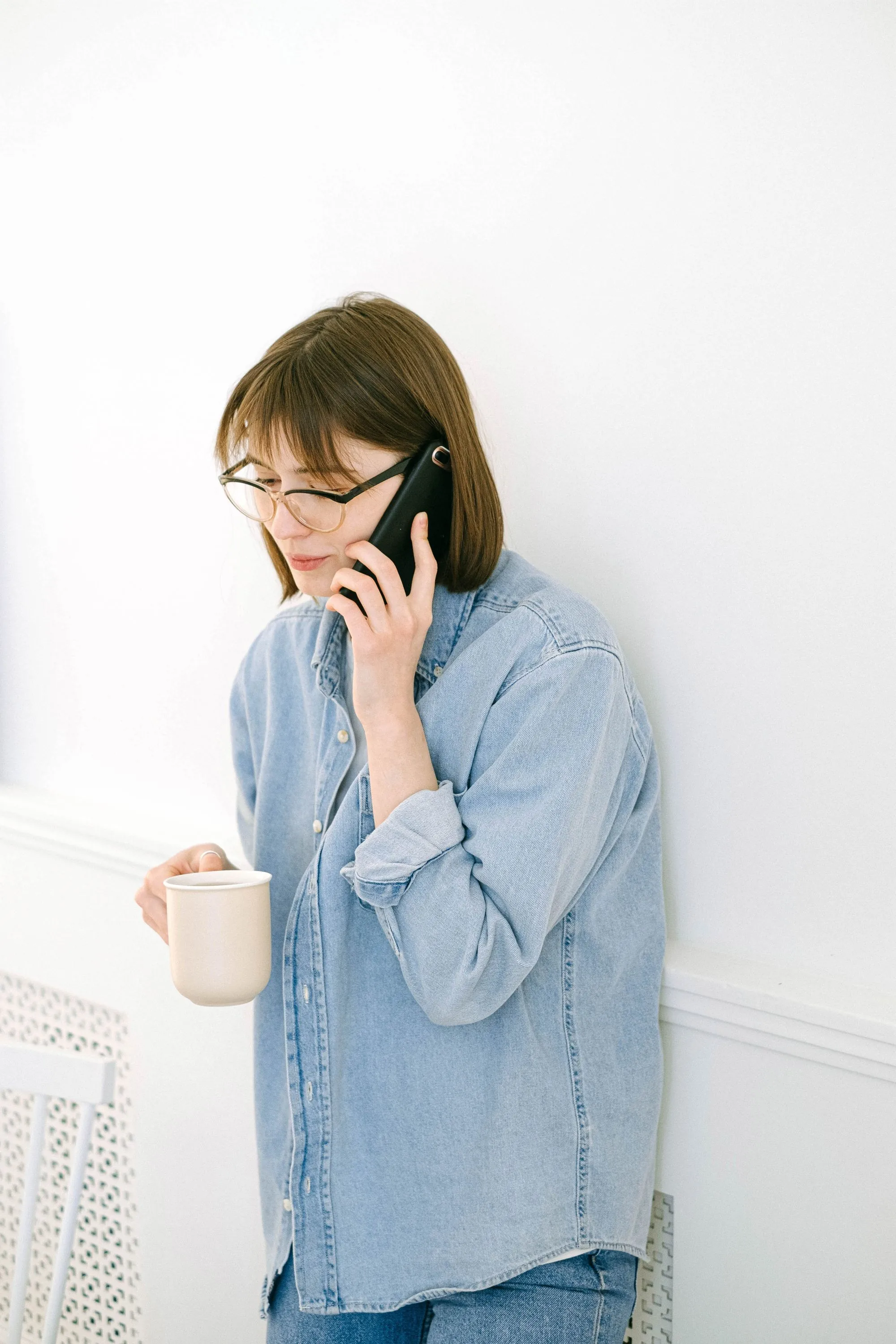 Someone making a phone call at home