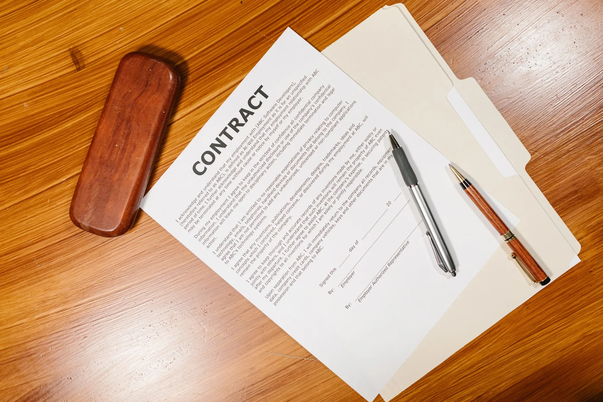 A written agreement and a pen on a desk